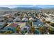 Aerial view of the neighborhood and surrounding mountains at 5522 Oakview Falls Ct, Las Vegas, NV 89148