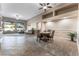 Open dining area with tile flooring and a view into the living room at 5522 Oakview Falls Ct, Las Vegas, NV 89148