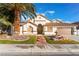 Single-story house with landscaped yard, fountain, and two-car garage at 5522 Oakview Falls Ct, Las Vegas, NV 89148