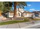 Single-story house with landscaped yard, fountain, and two-car garage at 5522 Oakview Falls Ct, Las Vegas, NV 89148