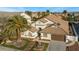 House with landscaped front yard, fountain, and palm trees at 5522 Oakview Falls Ct, Las Vegas, NV 89148