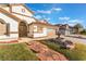 Landscaped front yard with stone pathway leading to the house entrance at 5522 Oakview Falls Ct, Las Vegas, NV 89148