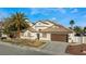 House with palm trees, fountain, and well-maintained landscaping at 5522 Oakview Falls Ct, Las Vegas, NV 89148