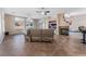 Spacious living room featuring tile floors, a fireplace, and ample natural light at 5522 Oakview Falls Ct, Las Vegas, NV 89148