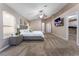 Main bedroom with walk-in closet, carpeted floors, and a ceiling fan at 5522 Oakview Falls Ct, Las Vegas, NV 89148