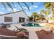 Large pool with patio and lounge chairs at 5522 Oakview Falls Ct, Las Vegas, NV 89148