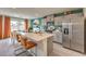 Modern kitchen with gray cabinets and a large island with seating at 5709 Scarlet Rock St, North Las Vegas, NV 89081