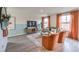 Bright living room featuring terracotta armchairs and a teal sofa at 5709 Scarlet Rock St, North Las Vegas, NV 89081