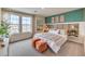 Spacious main bedroom with a wooden headboard and teal accent wall at 5709 Scarlet Rock St, North Las Vegas, NV 89081