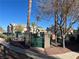 Gated entrance to a community pool area with lush landscaping at 5710 E Tropicana Ave # 2148, Las Vegas, NV 89122