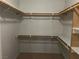 Spacious walk-in closet with ample shelving and hanging rods at 5710 E Tropicana Ave # 2148, Las Vegas, NV 89122