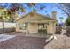 Backyard view with covered patio and gravel at 5954 Wabusca Way, Las Vegas, NV 89142