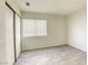 Bright bedroom with wood-look floors and sliding door closet at 5954 Wabusca Way, Las Vegas, NV 89142