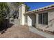 Front view of house with walkway, small yard, and white door at 5954 Wabusca Way, Las Vegas, NV 89142