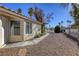 Side view of house with walkway and gravel landscaping at 5954 Wabusca Way, Las Vegas, NV 89142