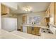 Well-equipped kitchen featuring light wood cabinets at 5954 Wabusca Way, Las Vegas, NV 89142