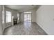 Living room with tile floors, fireplace, and sliding door to patio at 5954 Wabusca Way, Las Vegas, NV 89142