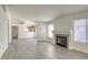 Living room with tile floors, fireplace and view of kitchen at 5954 Wabusca Way, Las Vegas, NV 89142