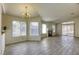 Open living and dining area with tile floor and fireplace at 5954 Wabusca Way, Las Vegas, NV 89142