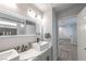 Modern bathroom with double vanity and view of hallway at 6034 Pirates Delight Ave, Las Vegas, NV 89139