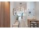 Modern entryway with wood wall accents, bench, and mirror at 6034 Pirates Delight Ave, Las Vegas, NV 89139