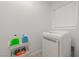 Laundry room with washer, dryer, and utility shelving at 6034 Pirates Delight Ave, Las Vegas, NV 89139