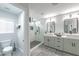 Modern bathroom with double vanity and large glass shower at 6034 Pirates Delight Ave, Las Vegas, NV 89139