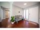 Inviting entryway with hardwood floors and a charming bench at 6575 Ellerhurst Dr, Las Vegas, NV 89103