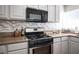 Gas range and granite countertops in this updated kitchen at 6575 Ellerhurst Dr, Las Vegas, NV 89103