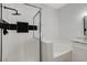 Bathroom with a shower, soaking tub, and black and white tile at 6821 Santa Isabel Ave # 104, Las Vegas, NV 89146