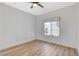 Well-lit bedroom with wood-look floors and a window offering natural light at 6821 Santa Isabel Ave # 104, Las Vegas, NV 89146