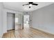 Bedroom with mirrored closet doors and wood-look floors at 6821 Santa Isabel Ave # 104, Las Vegas, NV 89146