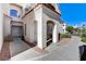 Front entrance of a building with a walkway and landscaping at 6821 Santa Isabel Ave # 104, Las Vegas, NV 89146