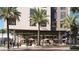 Herb & Haven storefront with outdoor seating and palm trees at 700 W Carson Ave # 1405, Las Vegas, NV 89106