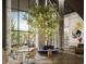 Modern lobby with a large tree and comfortable seating at 700 W Carson Ave # 1405, Las Vegas, NV 89106