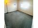 Spacious bedroom with carpeted floor and large window at 7458 Mezzanine View Ave, Las Vegas, NV 89178