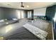 Spacious bedroom with projector, screen and two twin beds at 7458 Mezzanine View Ave, Las Vegas, NV 89178