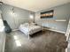 Cozy bedroom with grey walls, carpeted floor, and metal bed frame at 7458 Mezzanine View Ave, Las Vegas, NV 89178