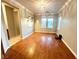 Bright dining room with wood flooring and large windows at 7458 Mezzanine View Ave, Las Vegas, NV 89178