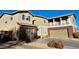 Two-story house with brick and siding, two-car garage, and landscaped yard at 7458 Mezzanine View Ave, Las Vegas, NV 89178