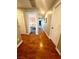 Long hallway with wood flooring and access to bedrooms at 7458 Mezzanine View Ave, Las Vegas, NV 89178