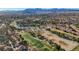 Aerial view of homes, golf course, and lake at 7500 Orange Haze Way, Las Vegas, NV 89149