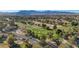 Aerial view of golf course and mountain range at 7500 Orange Haze Way, Las Vegas, NV 89149