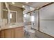 Bathroom with granite countertop, wood cabinets, and a shower/tub combo at 7500 Orange Haze Way, Las Vegas, NV 89149