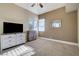 Bedroom with carpeted floors, ceiling fan, and built-in dresser at 7500 Orange Haze Way, Las Vegas, NV 89149