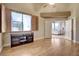 Bright bedroom with wood floors and access to living area at 7500 Orange Haze Way, Las Vegas, NV 89149