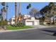 Two-story house with a two-car garage and lush green lawn at 7500 Orange Haze Way, Las Vegas, NV 89149