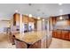 Island kitchen with granite countertops and hardwood floors at 7500 Orange Haze Way, Las Vegas, NV 89149