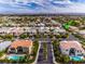 Aerial view showing home's location in a community with pools and mountain views at 7521 Yonie Ct, Las Vegas, NV 89117