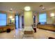 Spa-like bathroom with double vanities, a freestanding tub, and large windows at 7521 Yonie Ct, Las Vegas, NV 89117